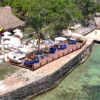 Seaside lounge area with umbrellas at Capri Beach Club