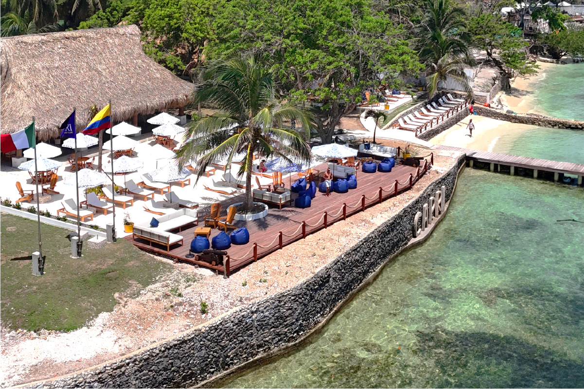 Seaside lounge area with umbrellas at Capri Beach Club