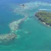 Aerial view of coral reef and turquoise water near Capri, Rosario Islands