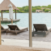 Terrace with lounge chairs overlooking the sea at Fragata Island House