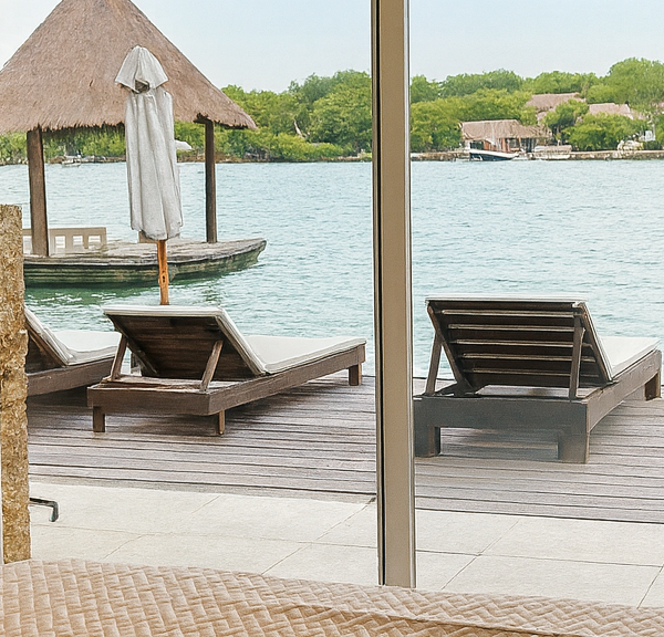 Terrace with lounge chairs overlooking the sea at Fragata Island House
