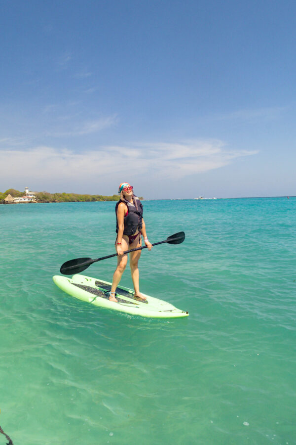 Paddle boarding in the clear Caribbean water off Ibbiza Island