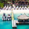 Aerial view of the pier, boats and turquoise water at Luxury Beach Club