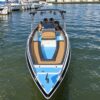 Bow view of the 28 ft Nederucho private boat on the water, showing the cushioned bow lounge and T-top, Cartagena