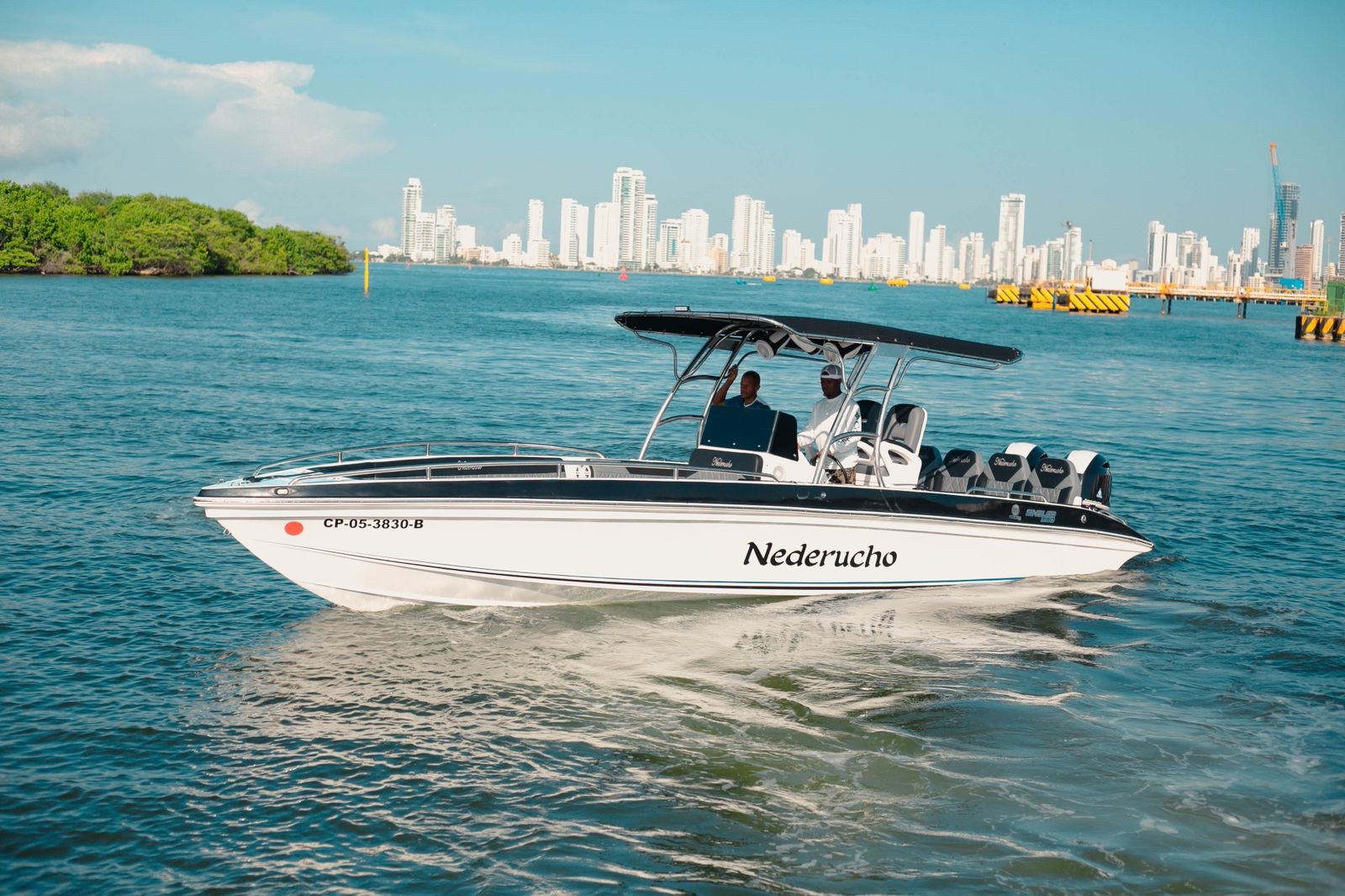 28 ft private boat Nederucho cruising in Cartagena Bay with the Bocagrande skyline