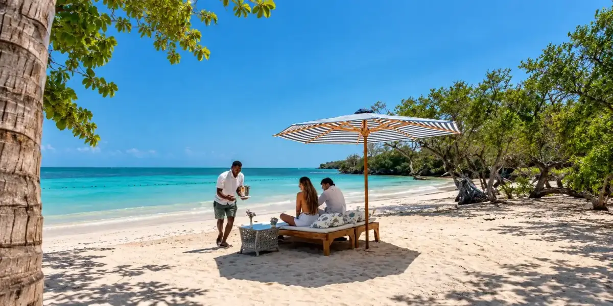 Beach service under an umbrella at Aguazul Beach Resort