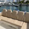 Rear bench and twin engines of the Altamare boat at the marina