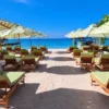 Beach loungers on the sand at Mantas Beach Club