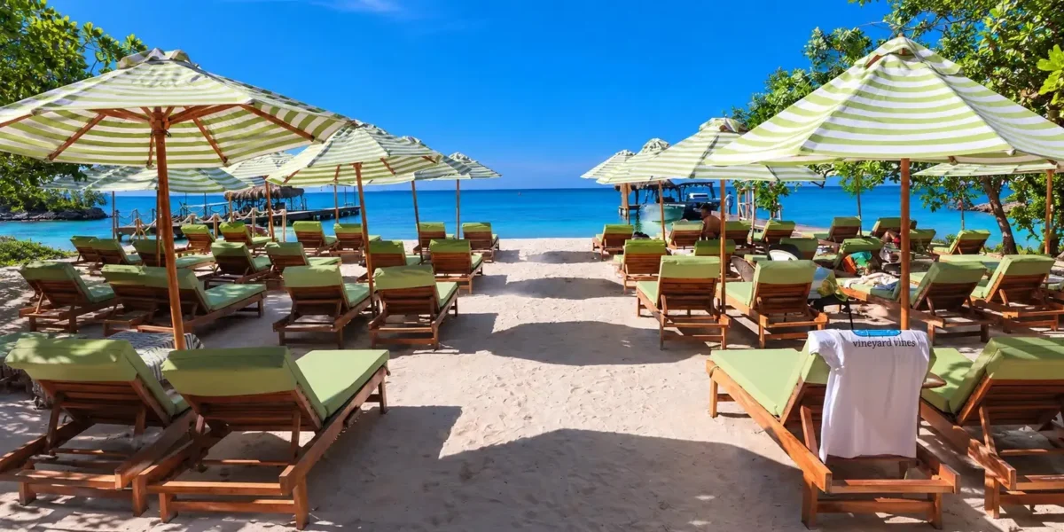 Beach loungers on the sand at Mantas Beach Club
