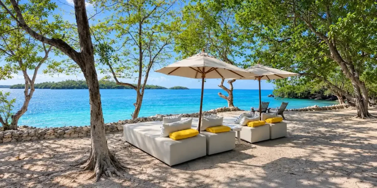 Beachfront lounge beds with umbrellas at Dharma Beach Club