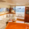 Air-conditioned salon with leather sofas and TV on the Bellajava yacht