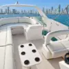 Flybridge with helm and sun lounge on the Bellajava yacht, Cartagena skyline behind