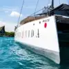 Bow of the Bonavida catamaran over turquoise water