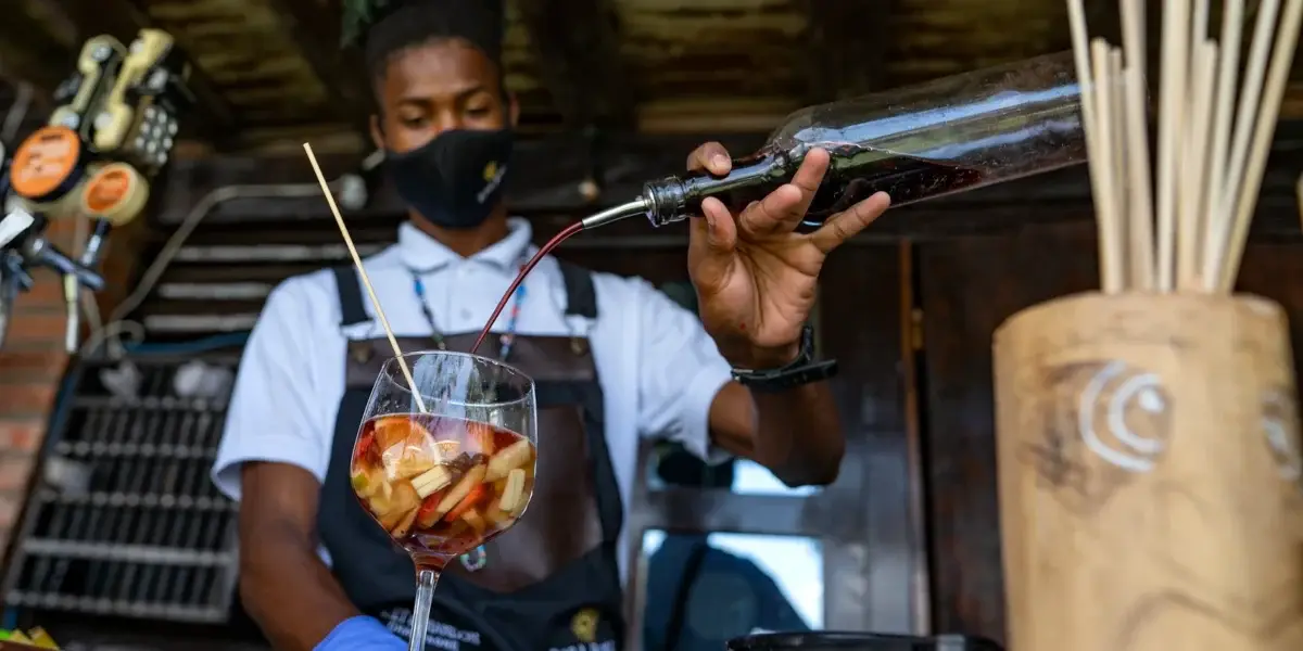 Bartender serving cocktails at Bora Bora Beach Club