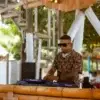 DJ at the bamboo booth of Bora Bora Beach Club, Rosario Islands