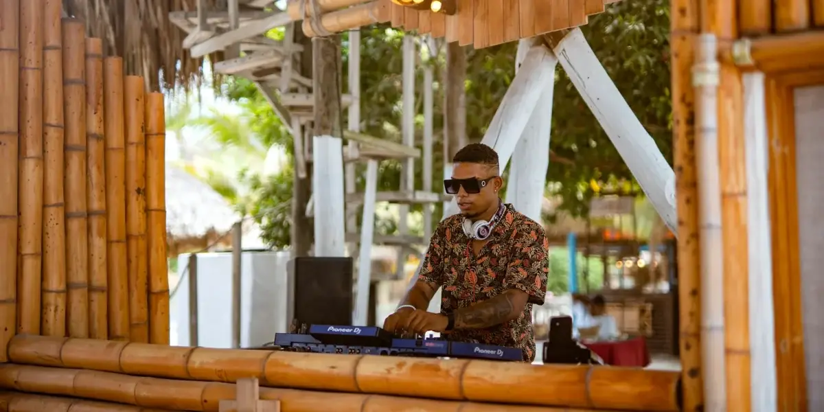 DJ at the bamboo booth of Bora Bora Beach Club, Rosario Islands