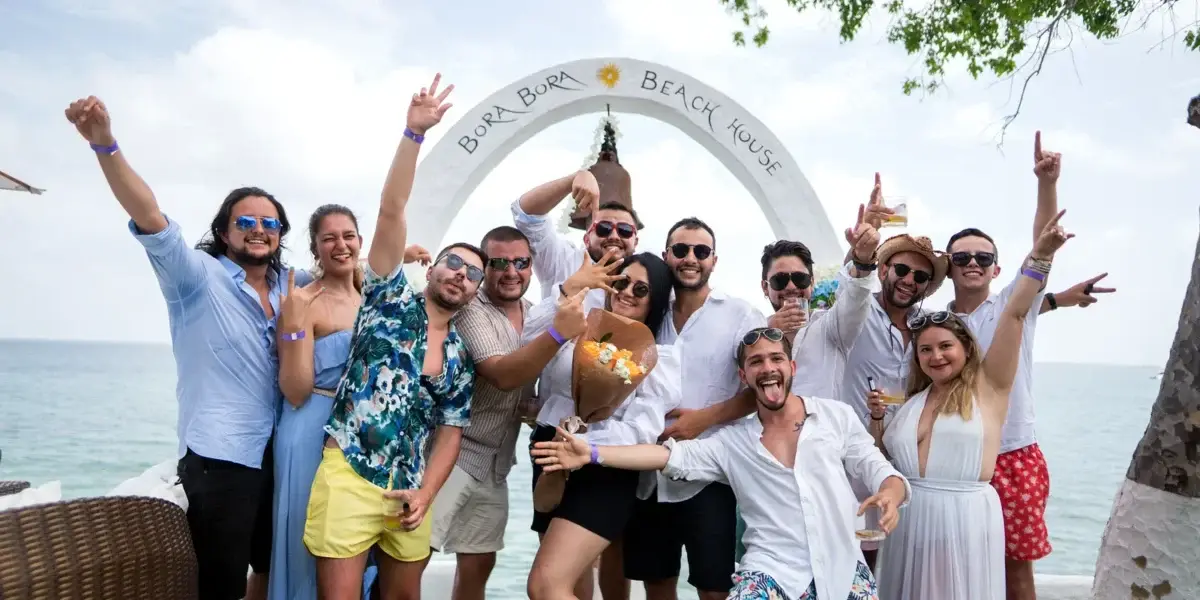 Group of friends at the Bora Bora Beach Club arch