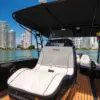 Helm seat under the canopy of the Catalunya boat with the Colombian flag
