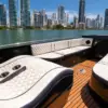 Bow sunbed and wood deck on the Catalunya private boat