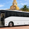 Side view of the 38-guest coach bus with the door open in Cartagena