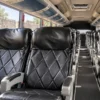 Leather reclining seats inside the coach bus for transfers in Cartagena