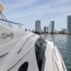 Side of the Cork Trick yacht with the Bocagrande skyline