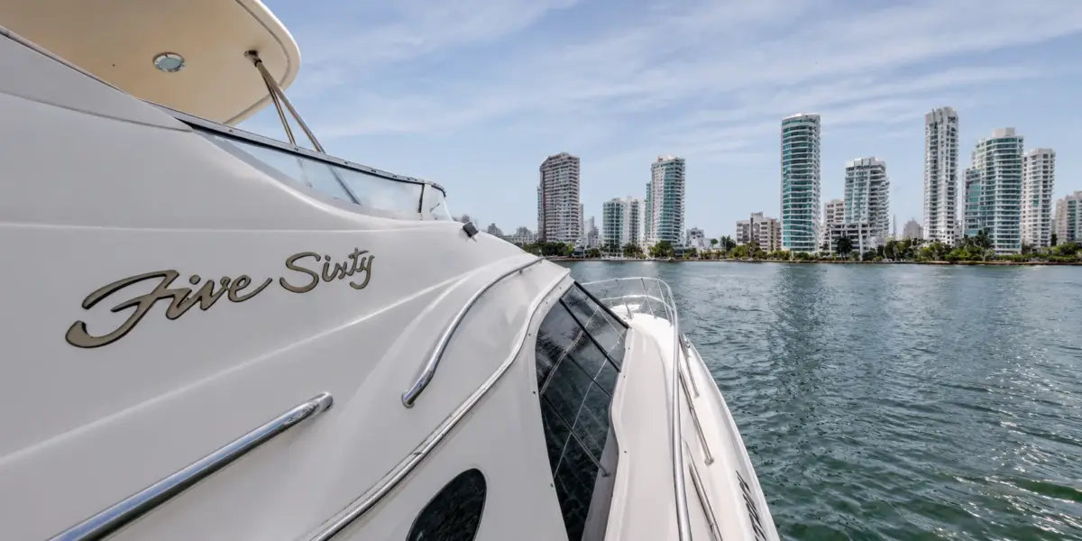 Side of the Cork Trick yacht with the Bocagrande skyline
