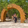 Couple at the Corona entrance arch on Corona Island