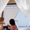 Couple relaxing in a private cabana at Bora Bora Beach Club