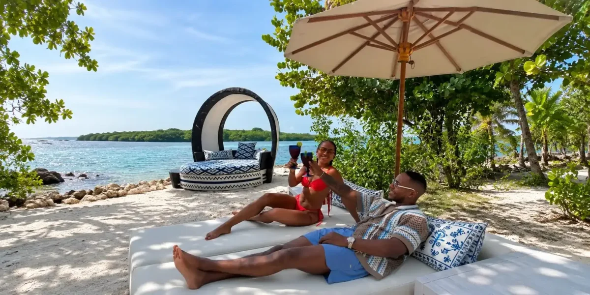 Couple relaxing on a beach bed at Dharma Beach Club