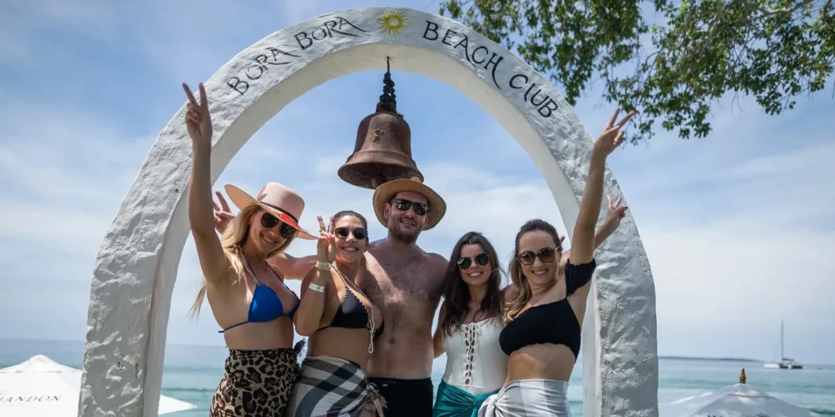 Friends at the Bora Bora Beach Club entrance arch