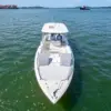 Interceptor private boat in Cartagena Bay with ships in the background