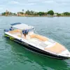 La Leona private boat with tan seating anchored near Castillogrande, Cartagena
