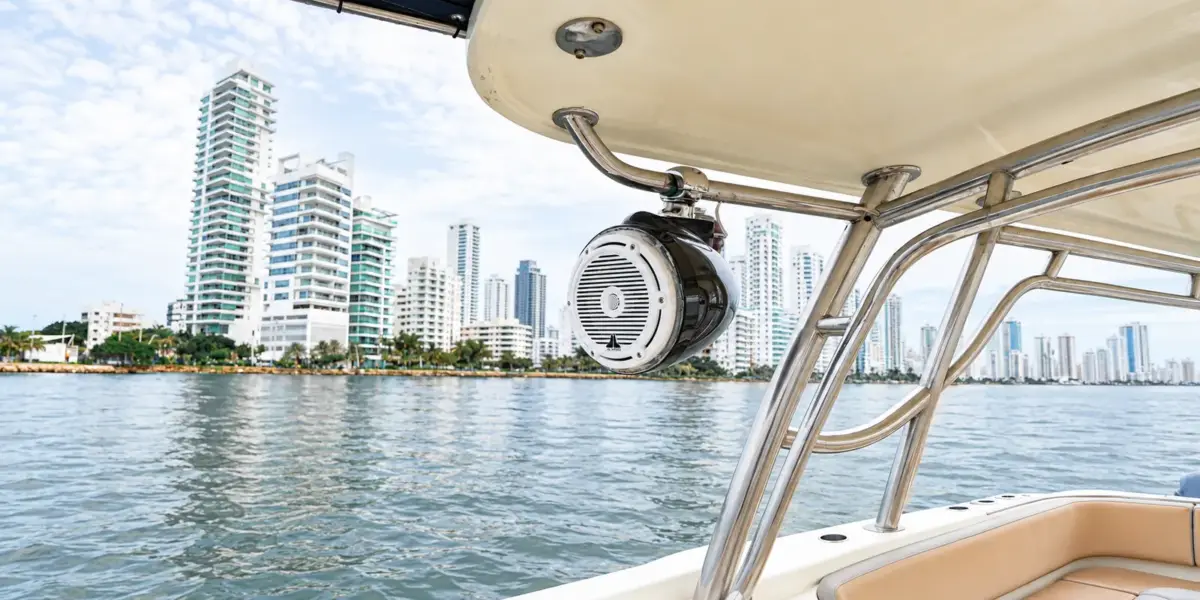 Marine speaker on the hardtop of La Leona with the Bocagrande skyline