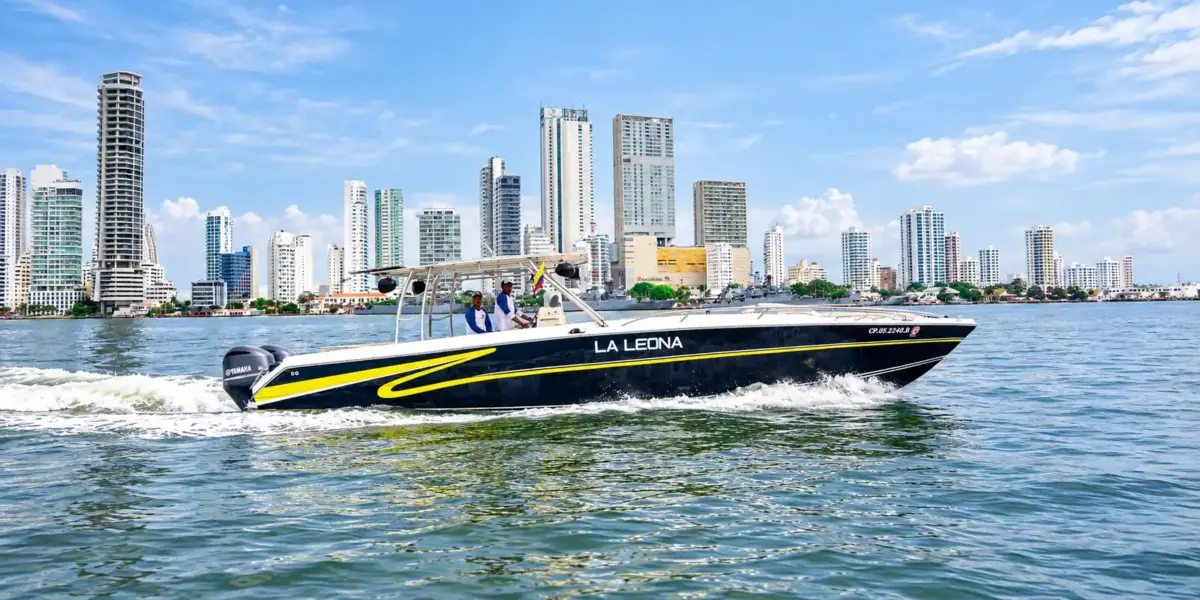 La Leona private boat cruising past the Bocagrande skyline