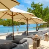 Lounge beds and umbrellas on the beach at Sabai Beach Club
