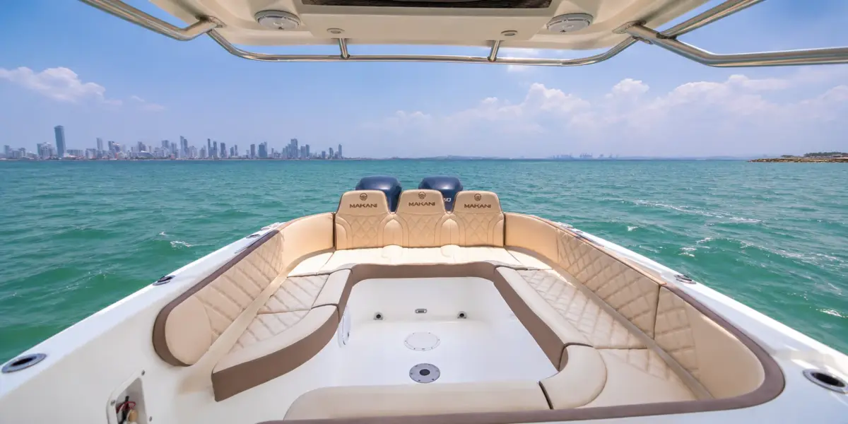 Cockpit and twin engines of the Makani boat with the Cartagena skyline