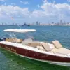 Makani 38 ft private boat with reclining sunbeds and the Cartagena skyline