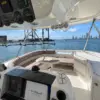 Flybridge with helm and lounge on the Mama's yacht overlooking Cartagena bay