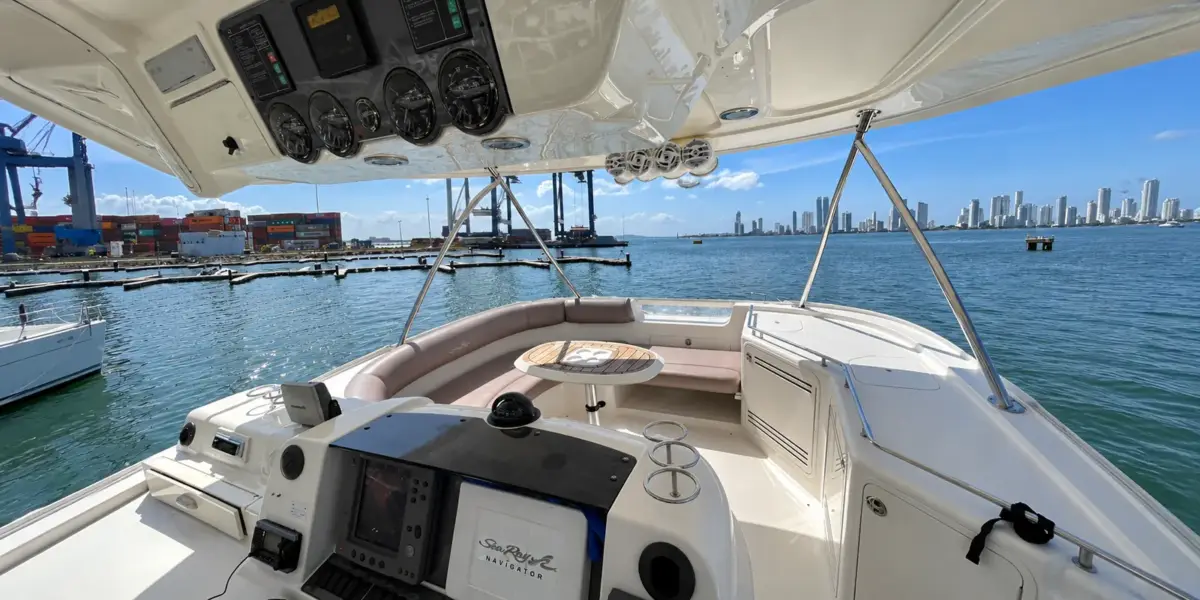 Flybridge with helm and lounge on the Mama's yacht overlooking Cartagena bay