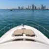 Bow sunbeds on the Mama's yacht facing the Bocagrande skyline