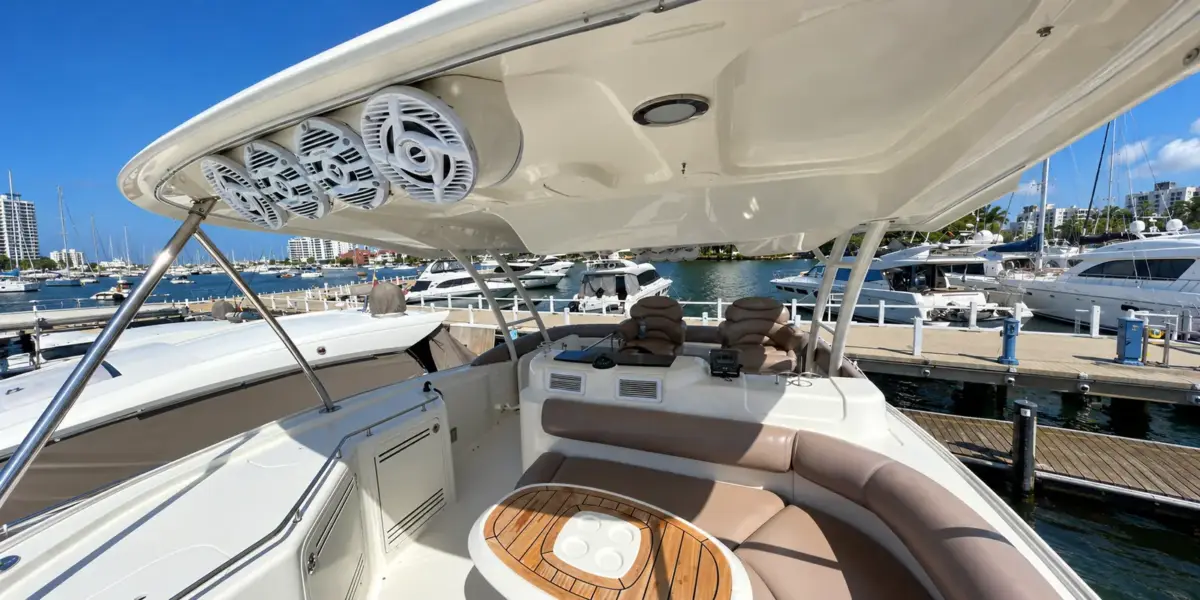 Flybridge lounge with seating and sound system on the Mama's yacht