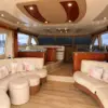 Salon with cream sofas and cushions on the Mama's yacht