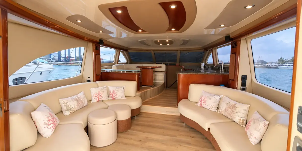 Salon with cream sofas and cushions on the Mama's yacht
