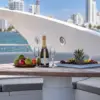 Champagne and fruit on the flybridge table of the Martlet yacht