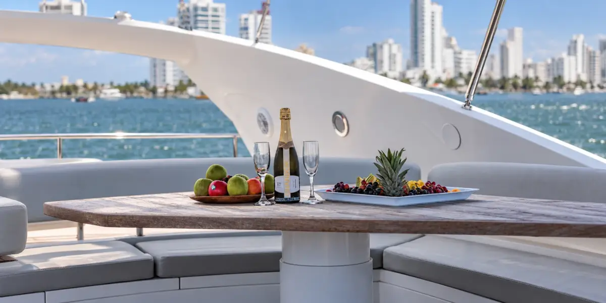 Champagne and fruit on the flybridge table of the Martlet yacht