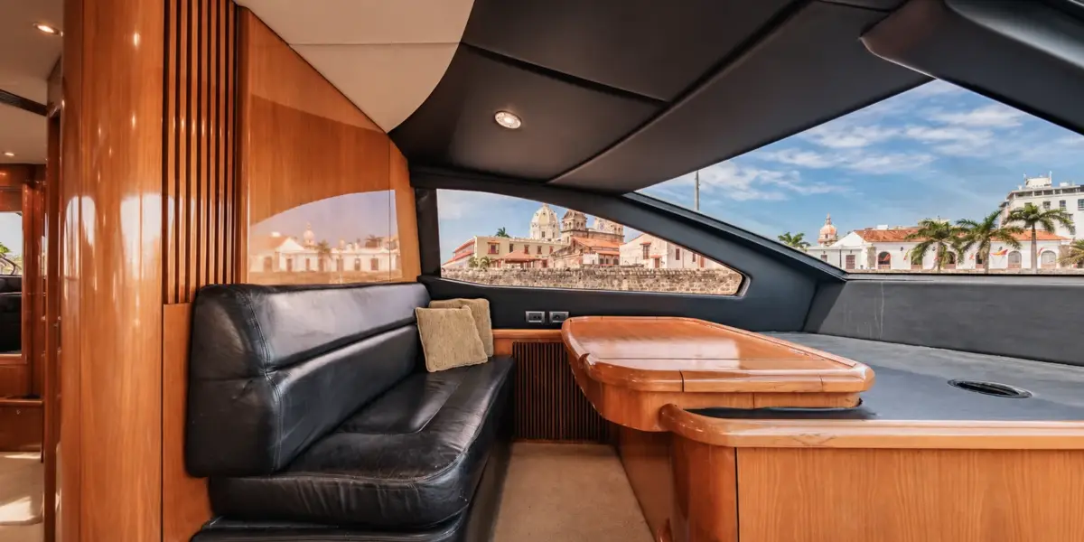 Upper lounge with leather sofa and a view of the old city on the Martlet yacht