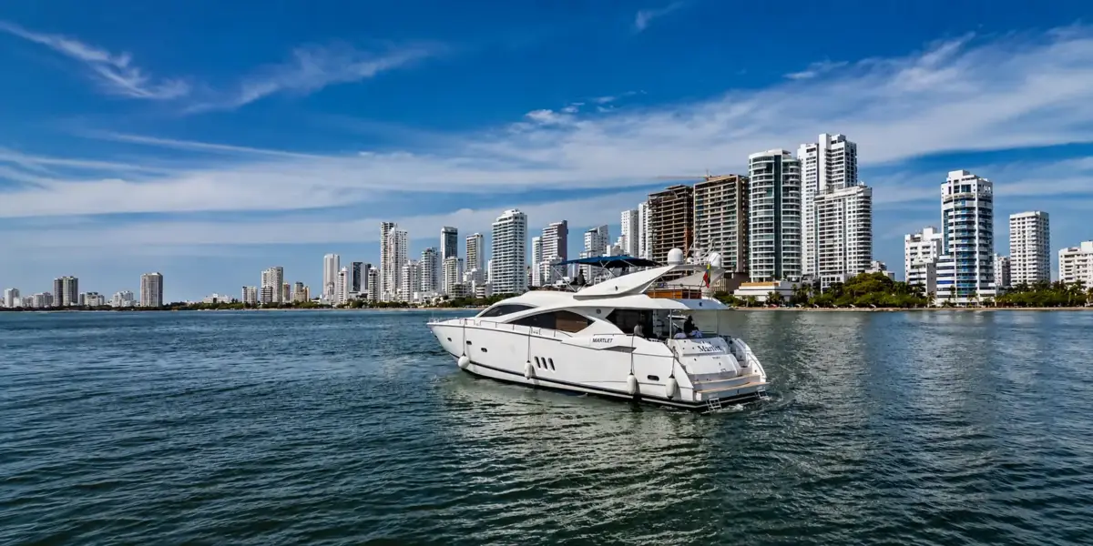 Martlet yacht cruising in front of the Bocagrande skyline, Cartagena