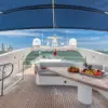 Shaded flybridge with dining table on the Martlet yacht