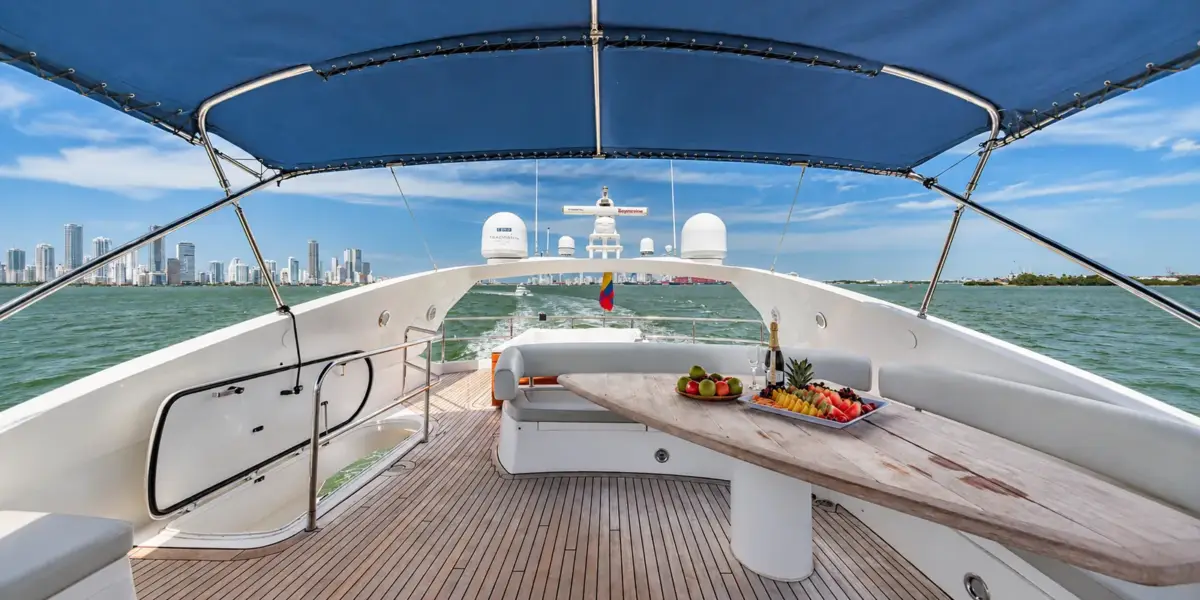 Shaded flybridge with dining table on the Martlet yacht